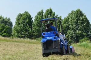 mini loader 6 series back with flail mower